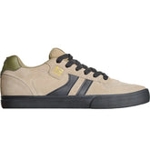 A low-top skate shoe by Skate North in beige suede with black side stripes, black laces, and a black sole, accented with an olive green heel tab and a gold logo.